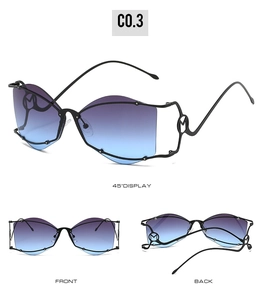 Vue détaillée des lunettes papillon avec verres dégradés et logo M en métal