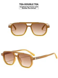 Detail of gradient tea lenses and double bridge frame on vintage aviator sunglasses