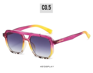 Detail view of double bridge sunglasses with pink and yellow gradient frame and gray lenses