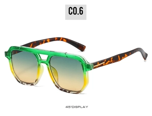 Detailed 45-degree angle view of green gradient sunglasses with tortoiseshell temples