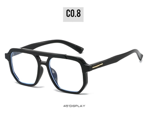 Detail view of black oversized double-bridge aviator frames with gold metal accents