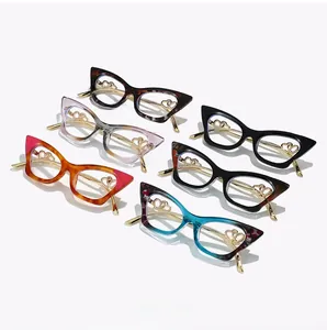 Detail of trendy cat-eye glasses frame featuring unique hollow double heart metal temples