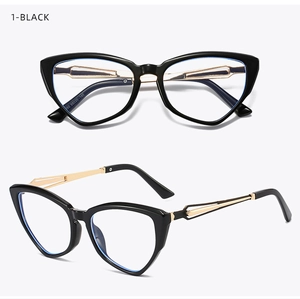 Detail of cat eye glasses with black frames, gold hollow metal temples and blue light lenses