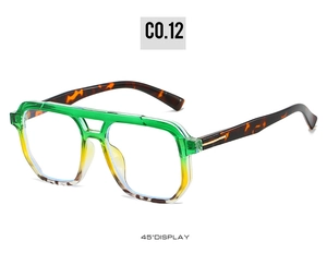 Detail view of double bridge sunglasses with green to yellow gradient and tortoiseshell temples