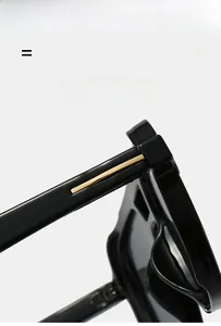 Detail of lightweight elastic sunglass hinge with gold metal trim and glossy finish