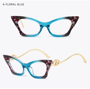 Detail of floral blue cat-eye frames with golden hinges and hollow double heart design