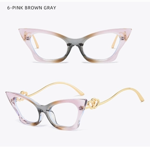 Detail of pink brown cat eye glasses frame with gold double heart hollow metal temples