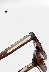 Macro detail of dark brown translucent eyewear temple with silver arrow texture inlay