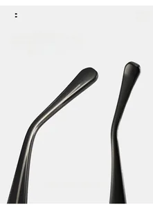 Detail of glossy black acetate sunglasses temple with reinforced internal metal core
