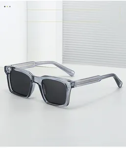 Detailed macro view of gray transparent square sunglasses with metal core inside temples