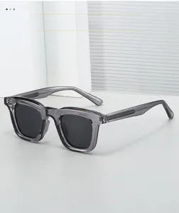 Detail of square translucent grey sunglasses frame with vertical non-slip texture on temple