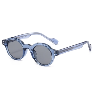 Retro round blue translucent sunglasses with textured temples and dark grey lenses