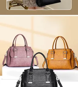 Three minimalist large capacity crossbody bags in pink, yellow and black with litchi texture