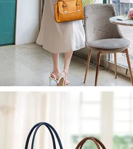 Detailed view of yellow leather tote with vintage metal buckle and dark contrast handles
