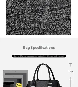 Detail showing the large capacity of a black pebbled leather tote bag with tech essentials