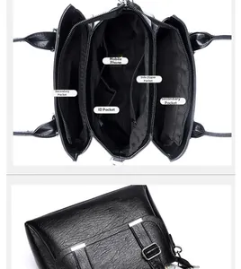 Detail view of large black leather bag showing multiple interior pockets and silver hardware
