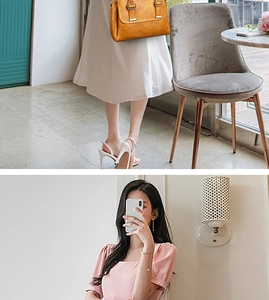 Detail of ginger yellow leather hobo bag with tassel and adjustable metal buckle strap