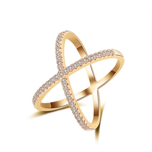 Close-up of rose gold bohemian ring featuring a crisscross X design with pavé white zircons