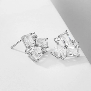 Macro view of geometric silver stud earrings with cluster rectangular cubic zirconia