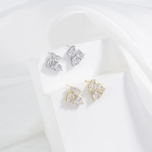 Elegant curved pear-cut zircon cluster stud earrings in silver and gold finishes