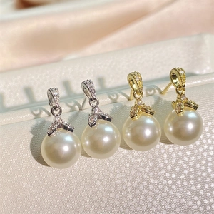 Elegant curved pearl drop earrings with micro-set zircons in gold and silver finishes