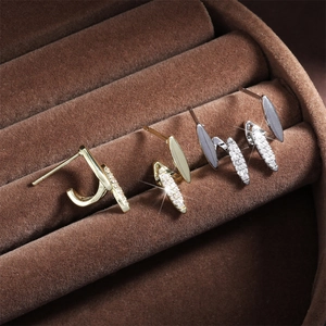 Minimalist curved pearl and zircon stud earrings in gold and silver finish set