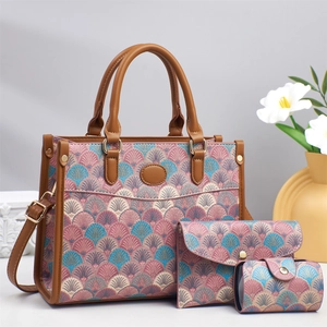 Three-piece tote bag set featuring pink teal jacquard pattern and brown leather straps