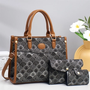 Three-piece printed tote set with geometric scallop pattern and brown leather straps