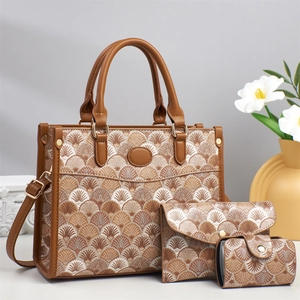 Three-piece printed tote bag set with textured shoulder strap and elegant pattern