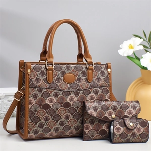 Detailed close-up of a 3-piece set printed tote bag, clutch and pouch in brown pattern