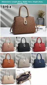 Detail view of large PU leather tote bag with floral texture and metal twist lock closure