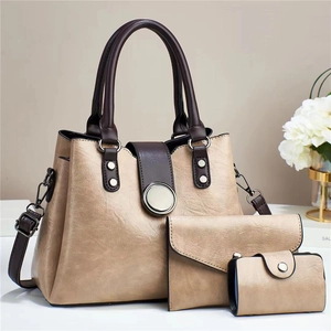 Three-piece camel and brown tote bag set with envelope clutch and round silver buckle