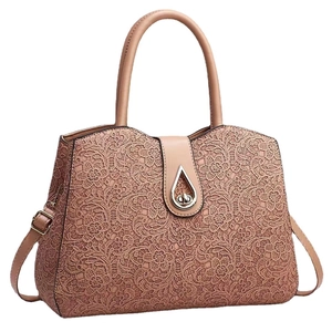 Pale pink faux leather tote bag with elegant lace embroidery and metal twist lock