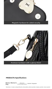 Close-up of golden heart-shaped magnetic buckle and internal structure of black PU bag