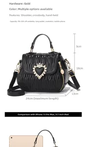 Detail of black V-quilted shell handbag with gold heart crown emblem and dimensions