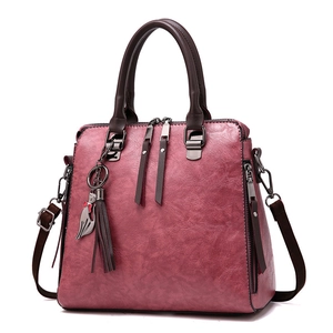Deep rose red faux leather handbag for women with crossbody strap and cat charm