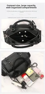 Detail view of large capacity black lychee leather bag with multiple inner storage pockets