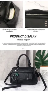 Macro view of black leather handbag featuring studded front pocket and star charm detail