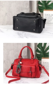 Detail view of large PU leather handbag showing anti-wear studs and star charm accessory