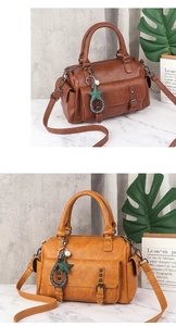 Detail of vintage soft PU leather handbag with multi-pocket design and natural texture