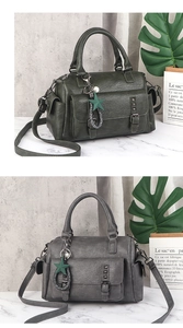 Detail view of retro faux leather handbags with studs and a star charm in deep green and grey