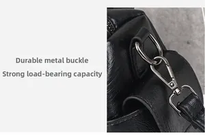 Close-up of durable gunmetal D-ring and swivel hook on black pebbled leather bag