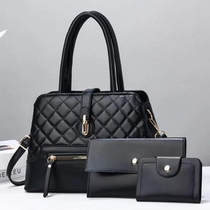 Three-piece black quilted faux leather handbag set with gold hardware and tote bag design