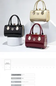 Three elegant cylindrical patent leather clutch bags in black, red, and gold with crystal lock