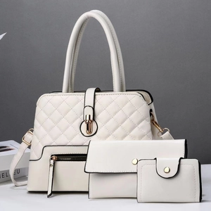 Detailed close-up of 3-piece quilted white PU leather handbag set with gold hardware