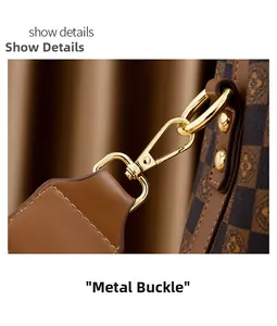 Détail du fermoir en métal doré et du cuir marron à motifs d'un sac à main de luxe