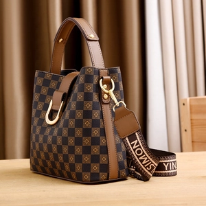 Brown checkerboard bucket bag with premium wide jacquard strap and gold hardware