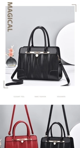 Details eleganter Tragetaschen in Schwarz und Weinrot mit Wellenstruktur und Goldteilen