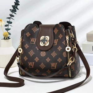 Detailed close-up of retro floral print bag with premium gold flower lock and chain strap