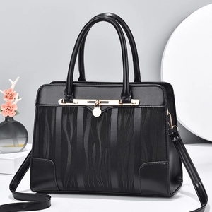 Black crocodile texture handbag with gold metal clasp and detachable shoulder strap